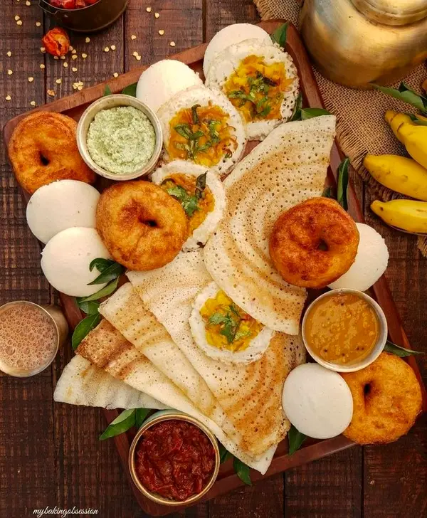 Breakfast spread of idli, vada, dosa, chutneys and sambar