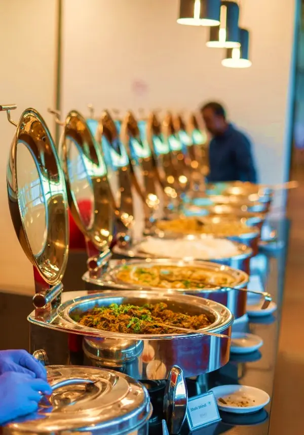 Row of chafing dishes on a buffet line