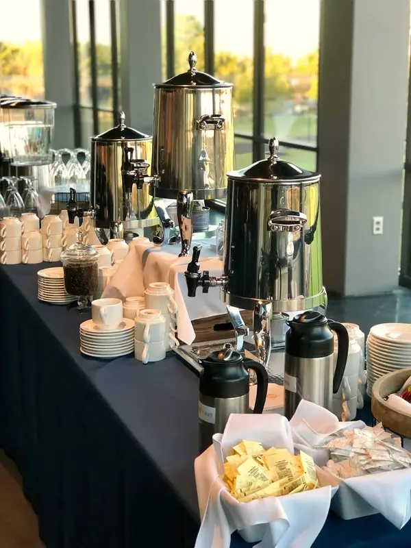 Tea and coffee station with urns and cups