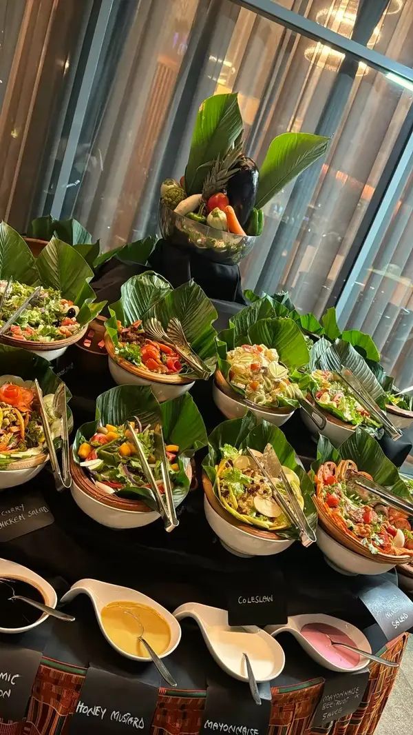 Salad and starter buffet decorated with greenery